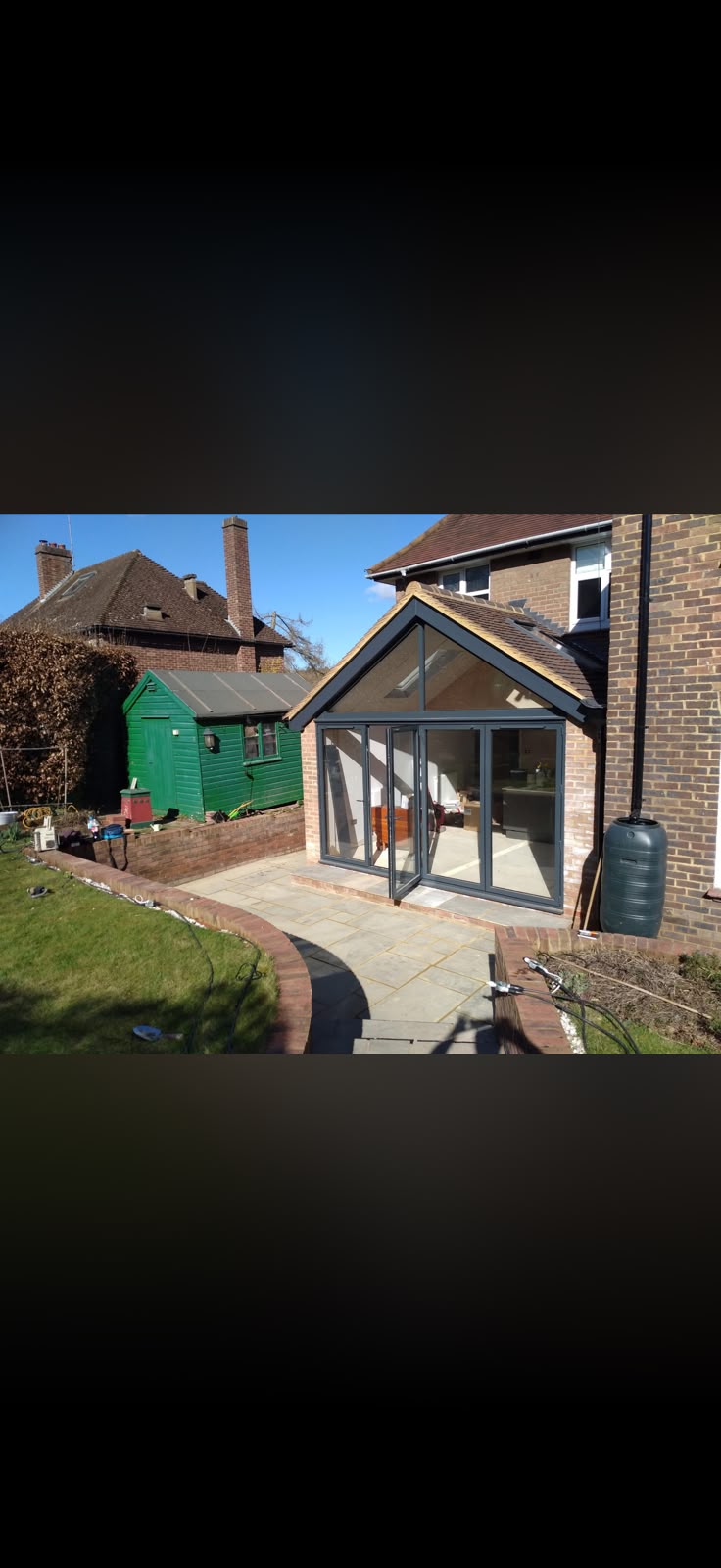Owner on-site discussing brickwork with a homeowner
